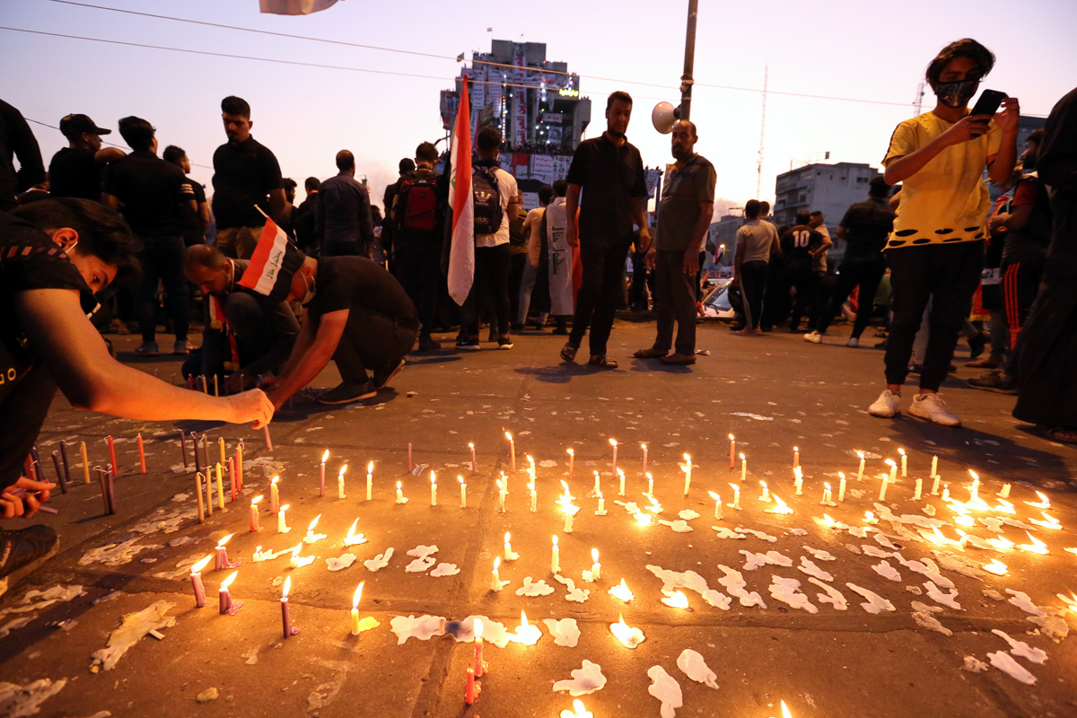 Iraqis light candles in the memory of the protesters who were killed by seurity forces since the corupt of protests at Tahrir squaer in central Baghdad, Iraq, 04 November 2019. At least eight proteste