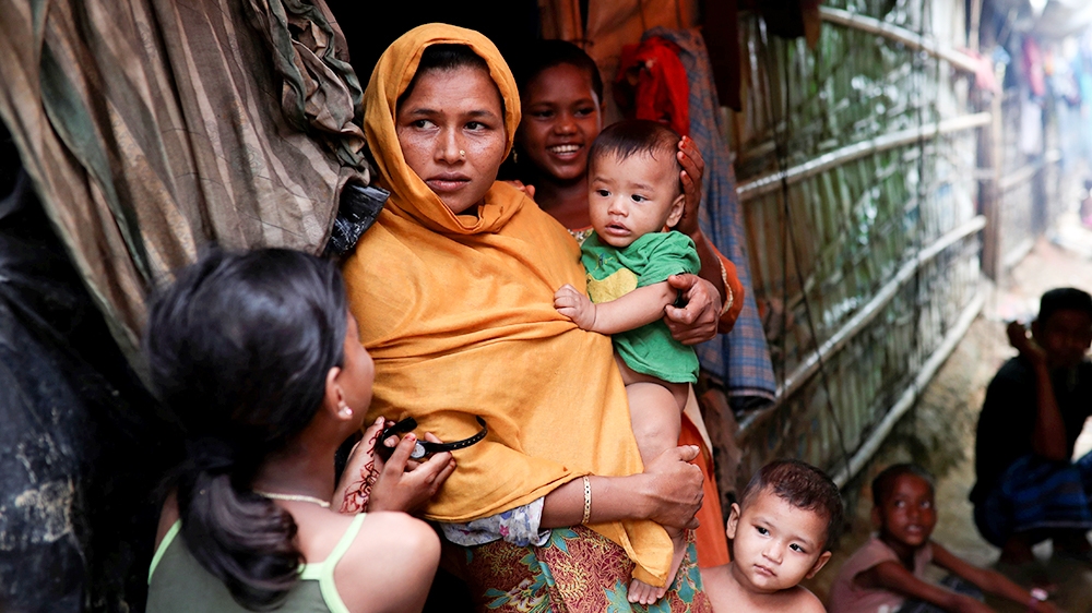 Rohingya refugees are seen outside of their makeshift tent in the Kutupalong camp in Cox's Bazar, Bangladesh August 24, 2018. REUTERS/Mohammad Ponir Hossain