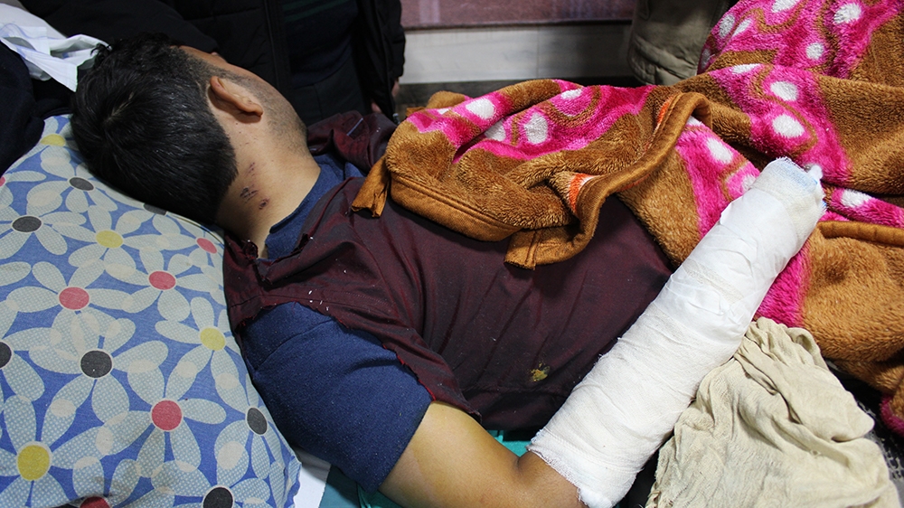 Mohammad Tariq pictured on the hpspital bed [Bilal Kuchay/Al Jazeera]