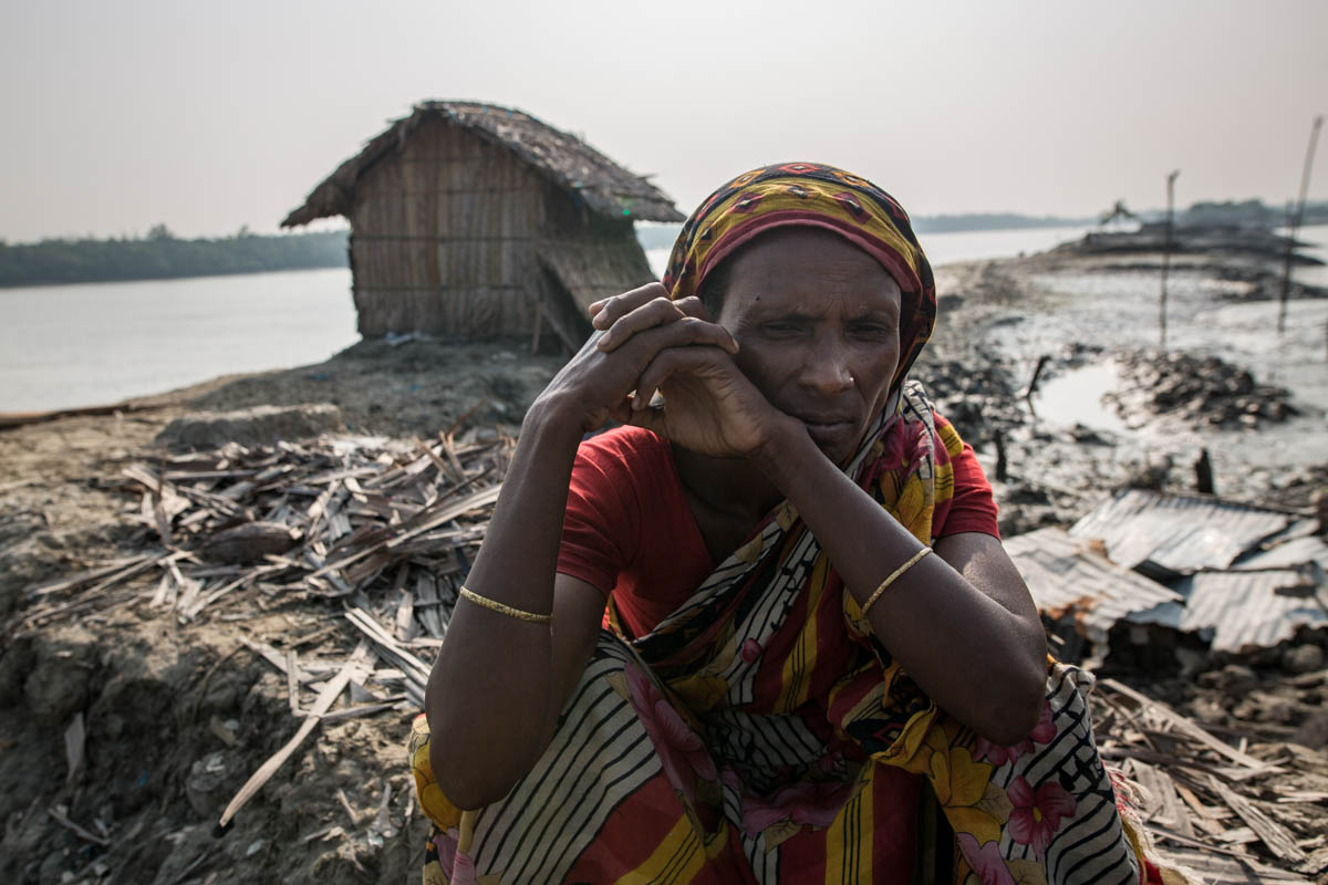 Afia Begum, 46, in front of her temporary house near Shibsha river, she shift her house 5 times cause of storm and soil erosion in a coastal area. She said, "Last I have lost my house during Cyclone F