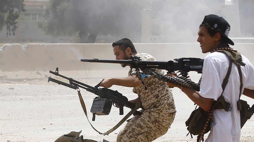 Fighters loyal to the internationally-recognised Government of National Accord (GNA) open fire from their position in the al-Sawani area south of the Libyan capital Tripoli during clashes with forces