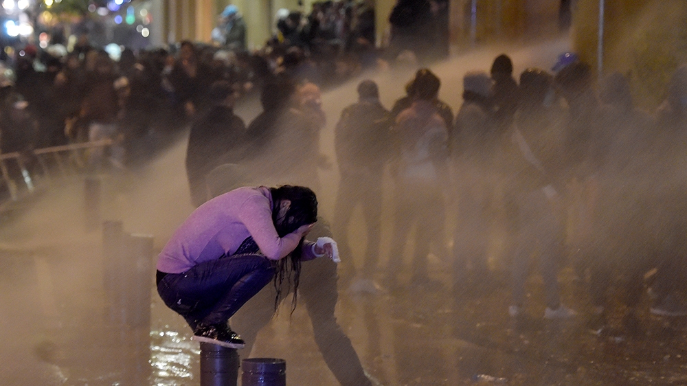 Lebanese riot police spray water at protesters during continuous anti-government protests outside of the Lebanese Parliament building in downtown Beirut, Lebanon, 22 January 2020. Lebanon announced on