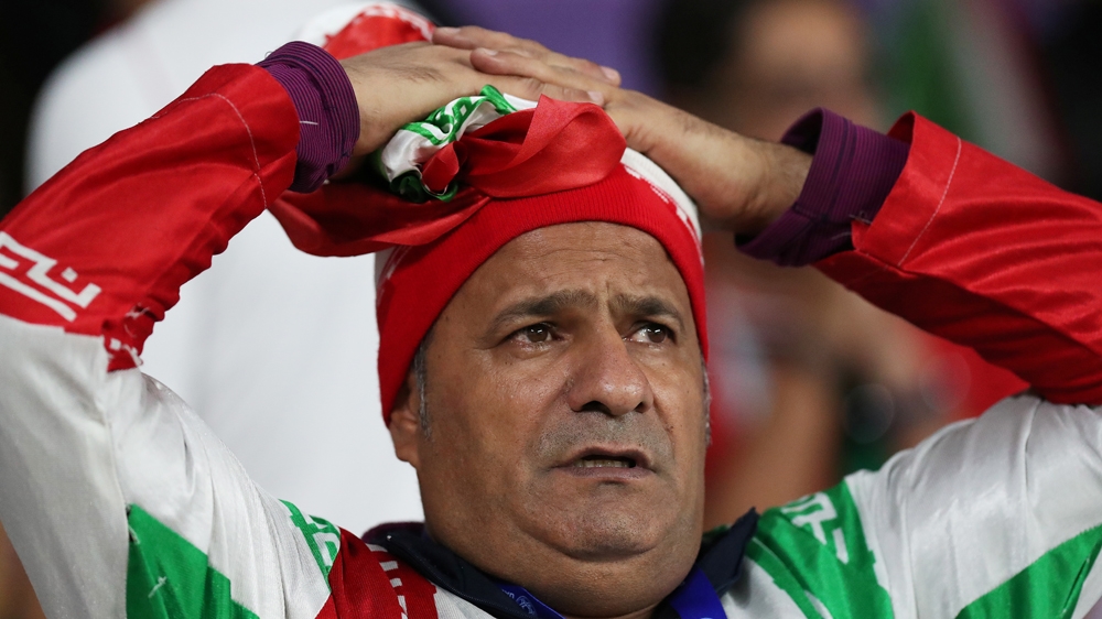 Soccer Football - AFC Asian Cup - Semi-Final - Iran v Japan - Hazza Bin Zayed Stadium, Al Ain, United Arab Emirates - January 28, 2019 An Iran fan looks dejected after the match REUTERS/Suhaib Salem