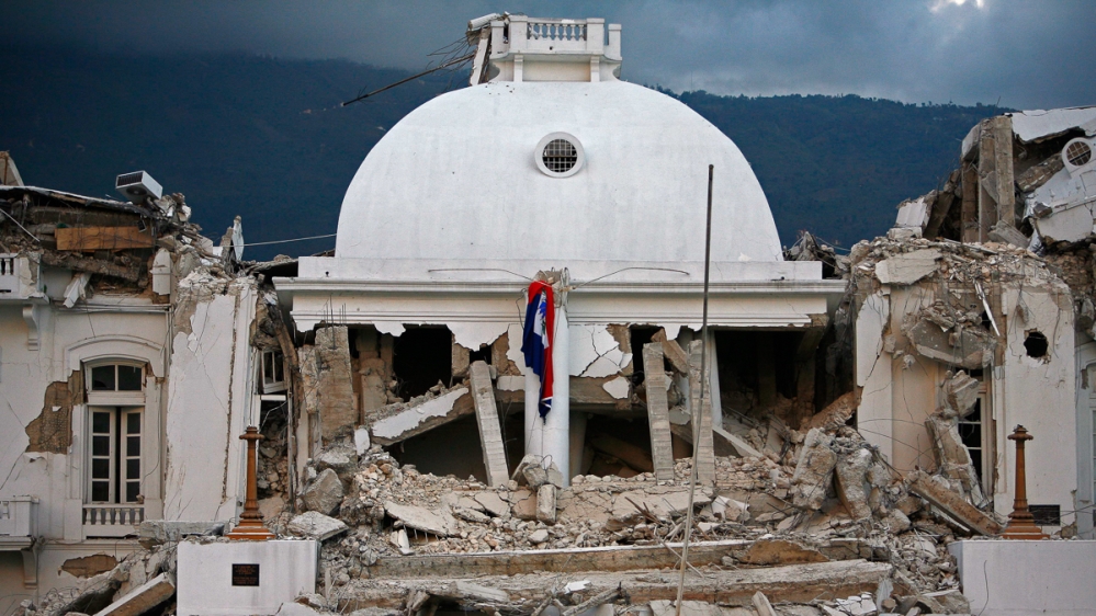The center dome of Haiti''s National Palace is seen collapsed after a 7.0-magnitude earthquake struck Port-au-Prince, Haiti, Wednesday, Jan. 13, 2010. (AP Photo/Ricardo Arduengo)