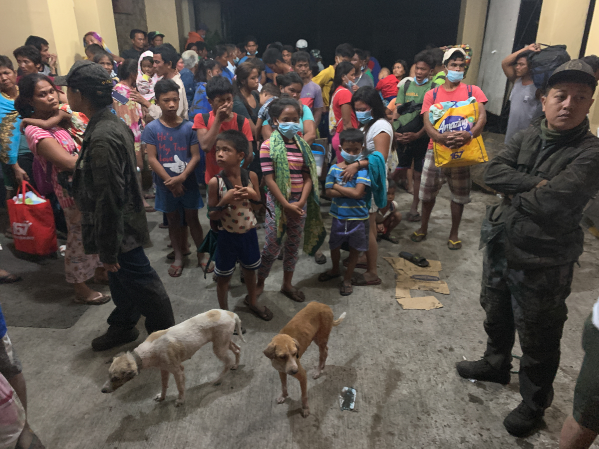 Villagers take shelter inside a church during an eruption of Taal Volcano, in Talisay, Batangas, Philippines, 12 January 2020. Thousands of people have been ordered to evacuate as authorities in the