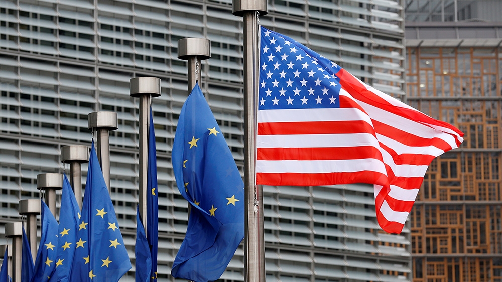 U.S. and European Union flags are pictured during the visit of Vice President Mike Pence to the European Commission headquarters in Brussels, Belgium February 20, 2017