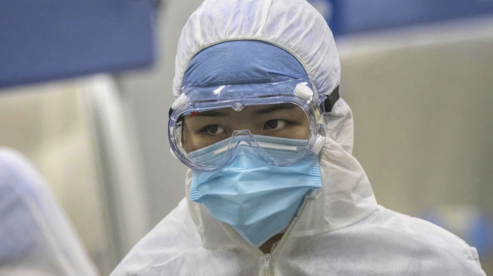 Employees work in the DaAn Gene laboratory in Guangzhou, Guangdong province, China, 19 February 2020. DaAn Gene Company of Sun Yat-Sun University focuses on the development and application of fluoresc