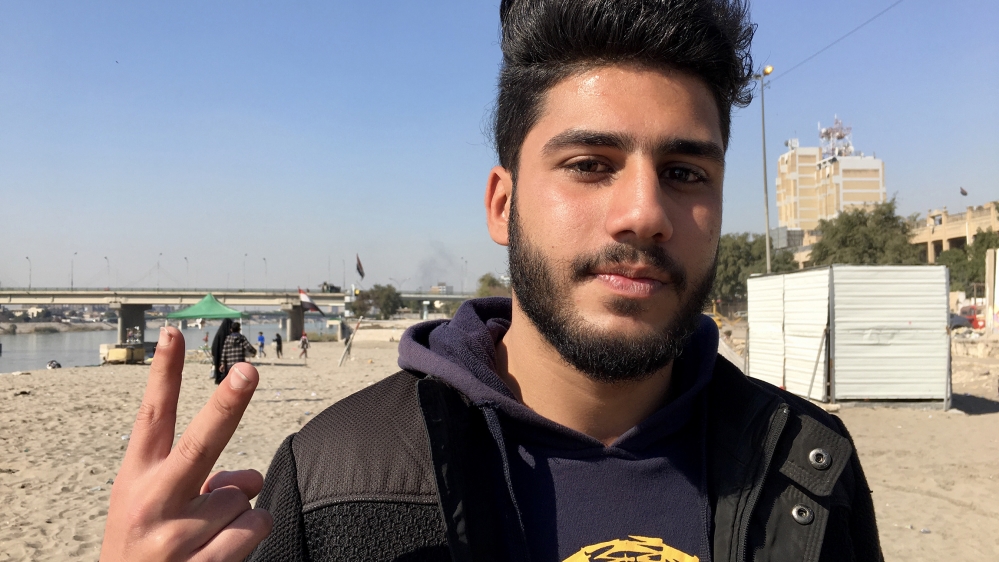 Medo and other young protesters say the blue caps are causing divisions in the protest movement