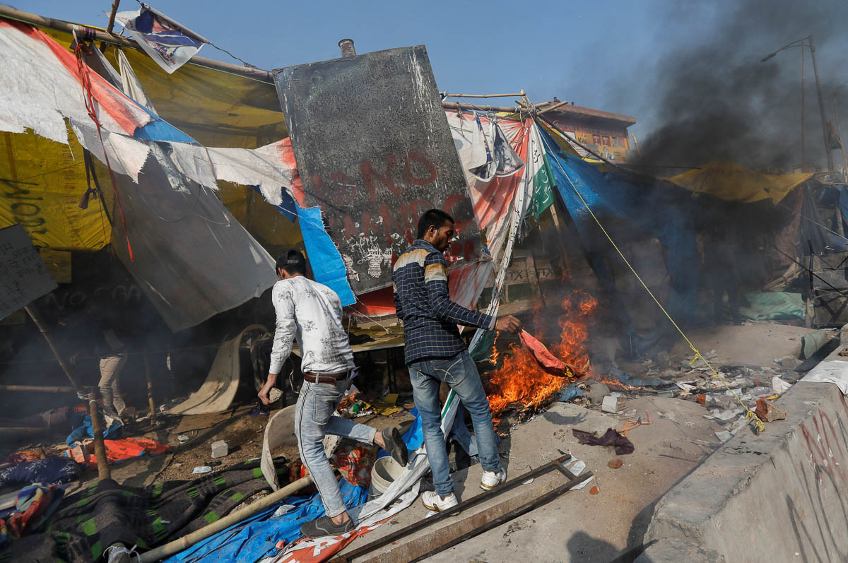 People supporting a new citizenship law destroy the protest site used by those opposing it, in New Delhi, India, February 24, 2020. REUTERS/Danish Siddiqui