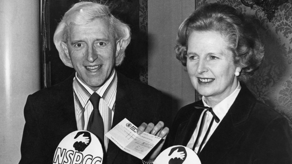 British Prime Minister Margaret Thatcher with English dj and television presenter Jimmy Savile (1926 - 2011) at an NSPCC (National Society for the Prevention of Cruelty to Children) fundraising presen