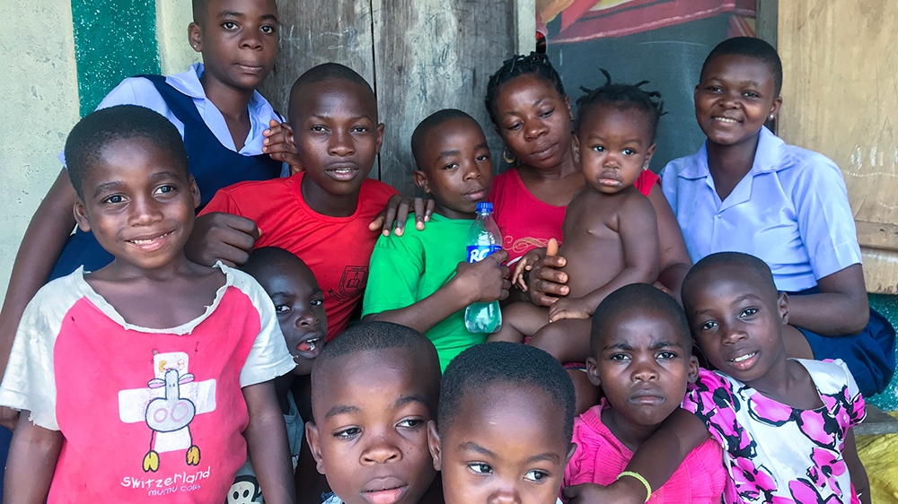 Anna Nga and her family in Ajassor border village in Cross River state [Linus Unah/Al Jazeera]