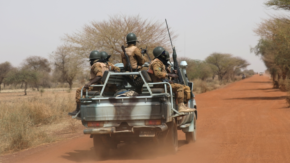 Soldiers from Burkina Faso patrol on the road of Gorgadji in sahel area, Burkina Faso