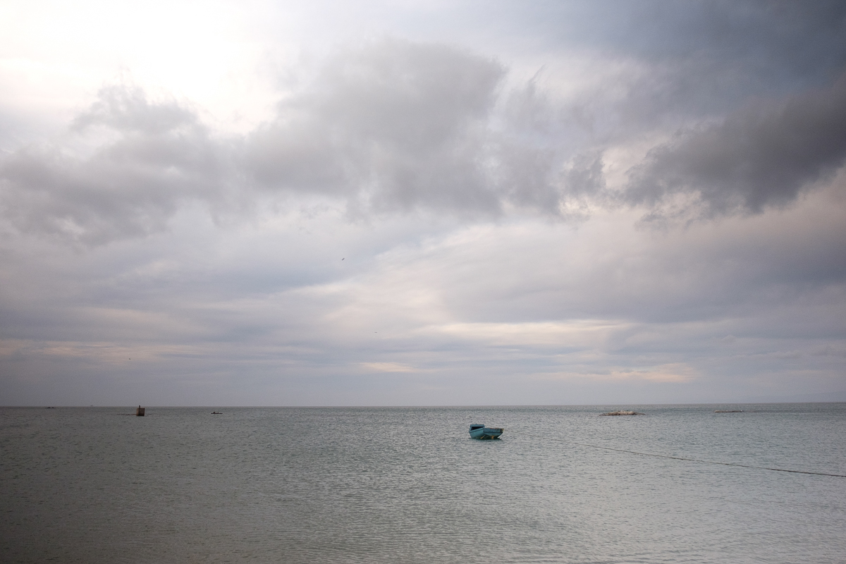 2 October 2019:Lifted by the incoming tide a small row boat floats just off the shore. Boats like these, called bakkies, are used to fish close to the shore. Fishing in Steenberg’s Cove is illegal but