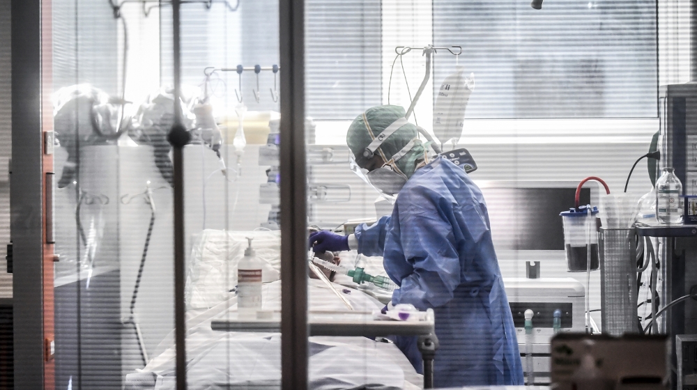 Medical personnel at work in the intensive care unit of the hospital of Brescia, Italy, Thursday, March 19, 2020. Italy has become the country with the most coronavirus-related deaths, surpassing Chin