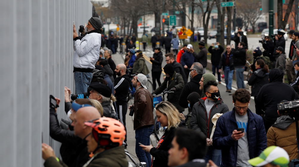 People watch as USNS Comfort docks at Pier 90 in New York City during the outbreak of coronavirus in NY, US [Andrew Kelly/Reuters]