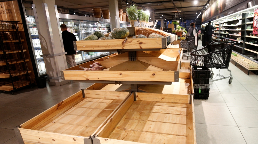 A supermarkets vegetable racks are empty as people stock up on food after the government announced measures to curb coronavirus infections in Hillcrest