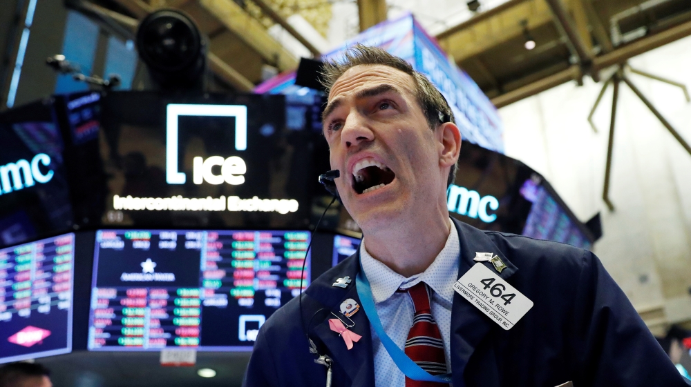A trader works on the floor at the New York Stock Exchange (NYSE) in New York City, U.S., March 5, 2020. REUTERS/Andrew Kelly