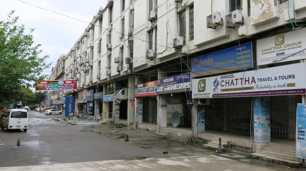 Islamabad's normally busy Blue Area market lies abandoned on Wednesday, as authorities mandated that only stores selling essential food and medicines could remain open