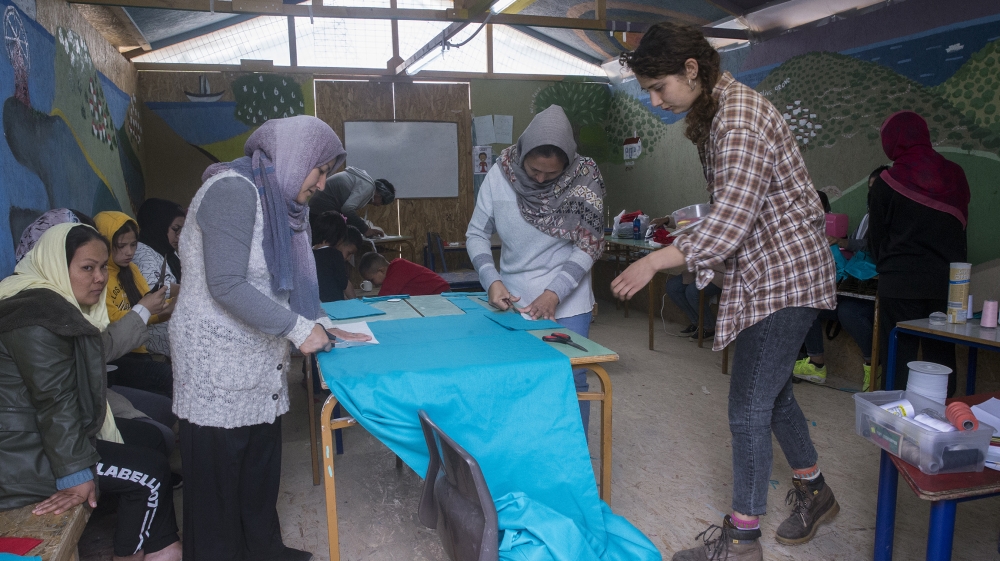 Asylum seekers, living in the Moria Camp, produce face masks against coronavirus (COVID-19), on March 15, 2020 in Lesbos Island, Greece on March 15, 2020. Following the mask stock shortage across the 