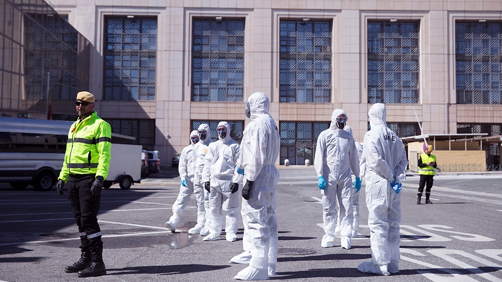 epa08298513 Members of the Military Emergency Unit (UME) work during desinfection works at the International Airport in Malaga, Spain, 16 March 2020. Spain has seen nearly 8,000 people infected and al