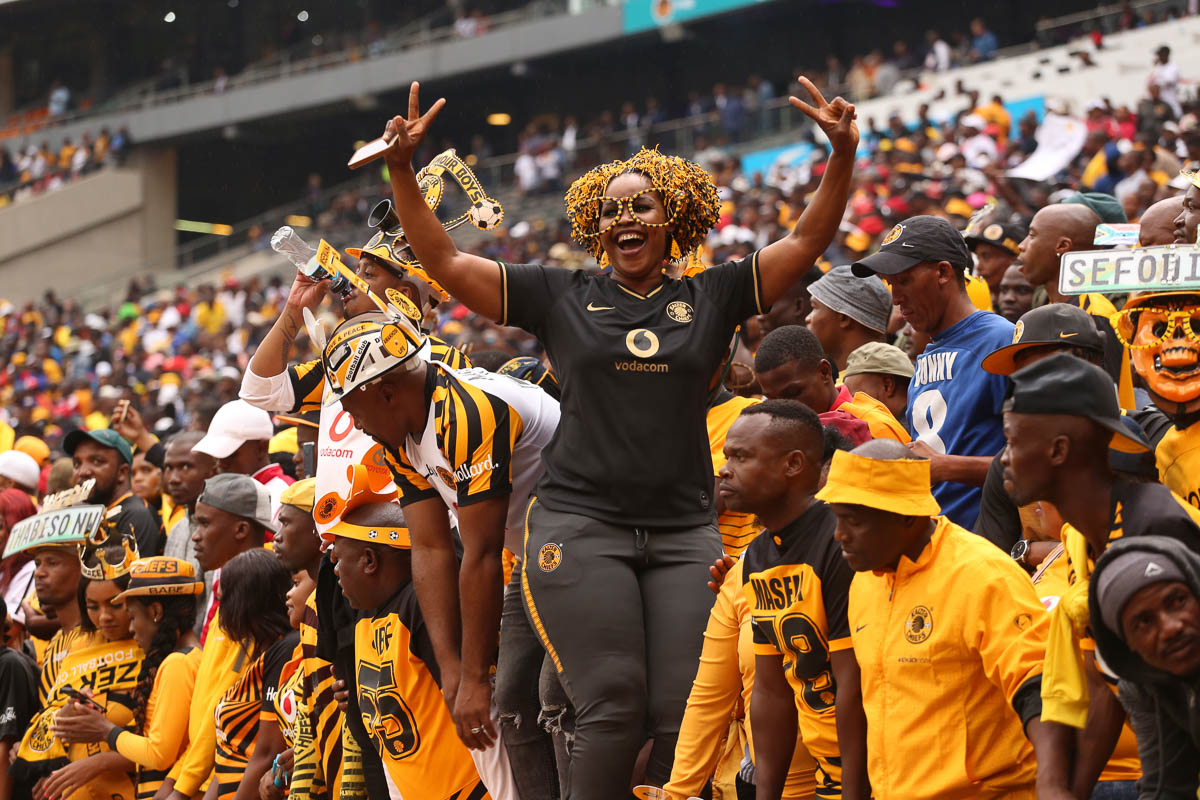 A kaizer chiefs fan Nelly Kubai celebrates after her team Kaizer scoered the 1-0 against rivals Orlando Pirates. She has ben a Chiefs supporter for over 20 years and on tis days she had travelled fro