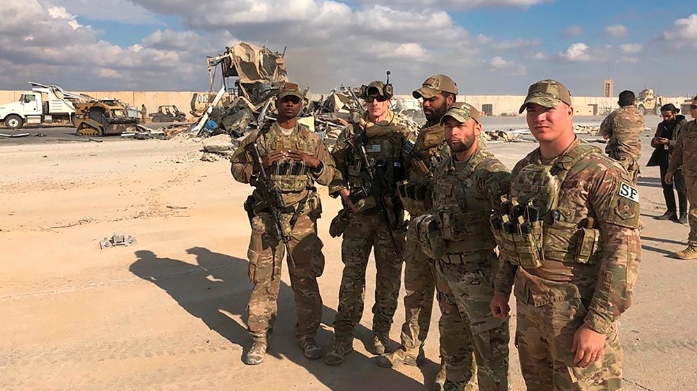 U.S. Soldiers stand in the site of the Iranian bombing at Ain al-Asad air base in Anbar, Iraq, Monday, Jan. 13, 2020. Ain al-Asad air base was struck by a barrage of Iranian missiles on Wednesday, in