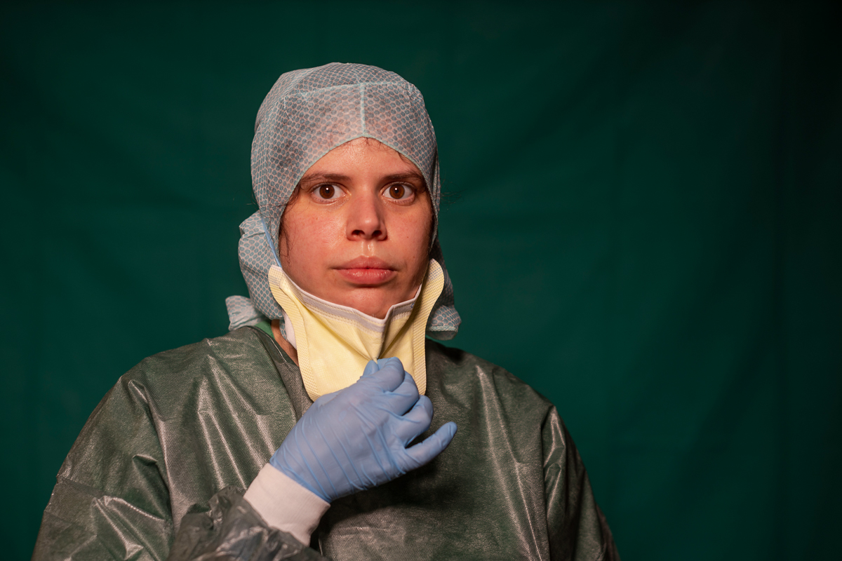 Claudia Accardo, ICU transport service at Rome''s COVID 3 Spoke Casalpalocco Clinic, poses for a portrait, Friday, March 27, 2020, during a break in her daily shift. The intensive care doctors and nurs