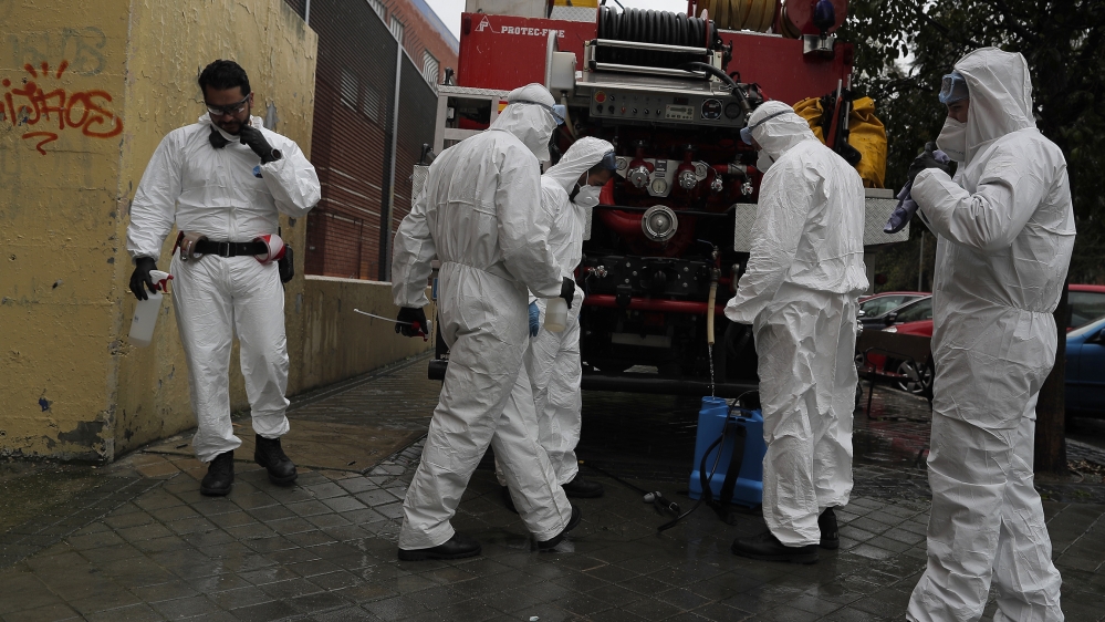 Members of the UME (Emergency Army Unit) wearing protective suits to protect from coronavirus prepare to disinfect at a nursing home in Madrid, Spain, Tuesday, March 31, 2020. The new coronavirus caus