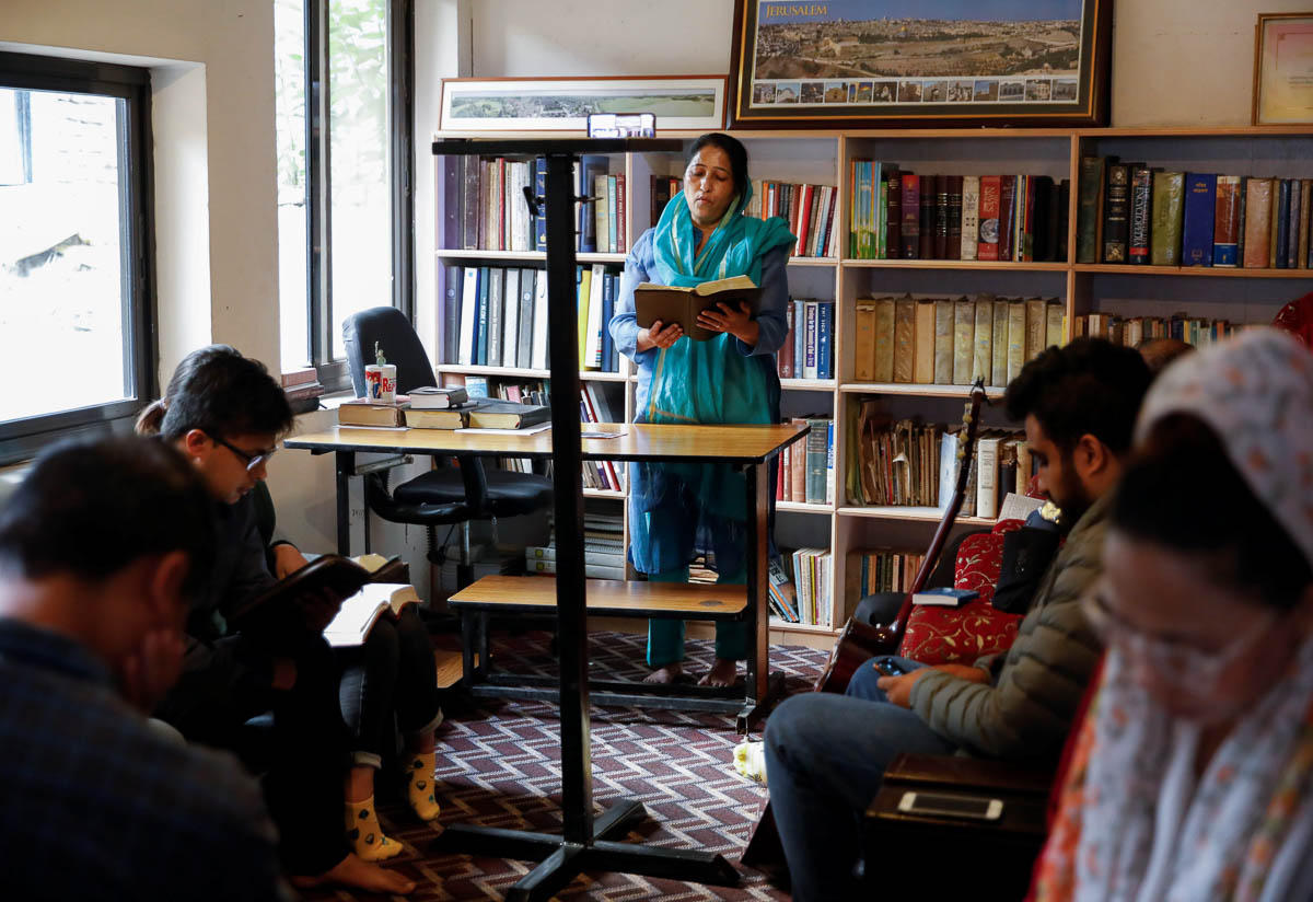 A woman offers prayer during a live-streamed Easter Session held by the pastor Chitra Khadka (not pictured) while the spread of coronavirus disease (COVID-19) continues, in Kathmandu, Nepal April 12,