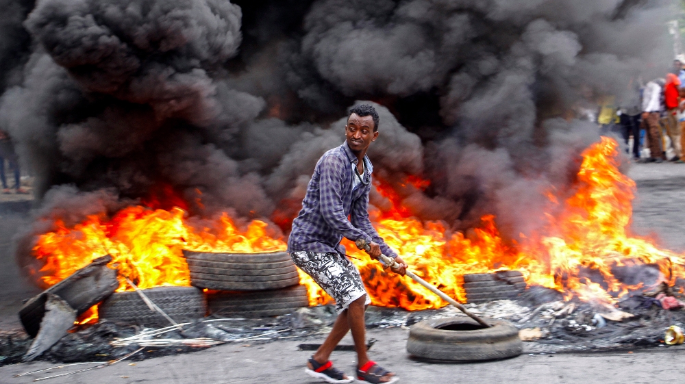 A Somali man protests against the killing Friday night of at least one civilian during the overnight curfew, which is intended to curb the spread of the new coronavirus