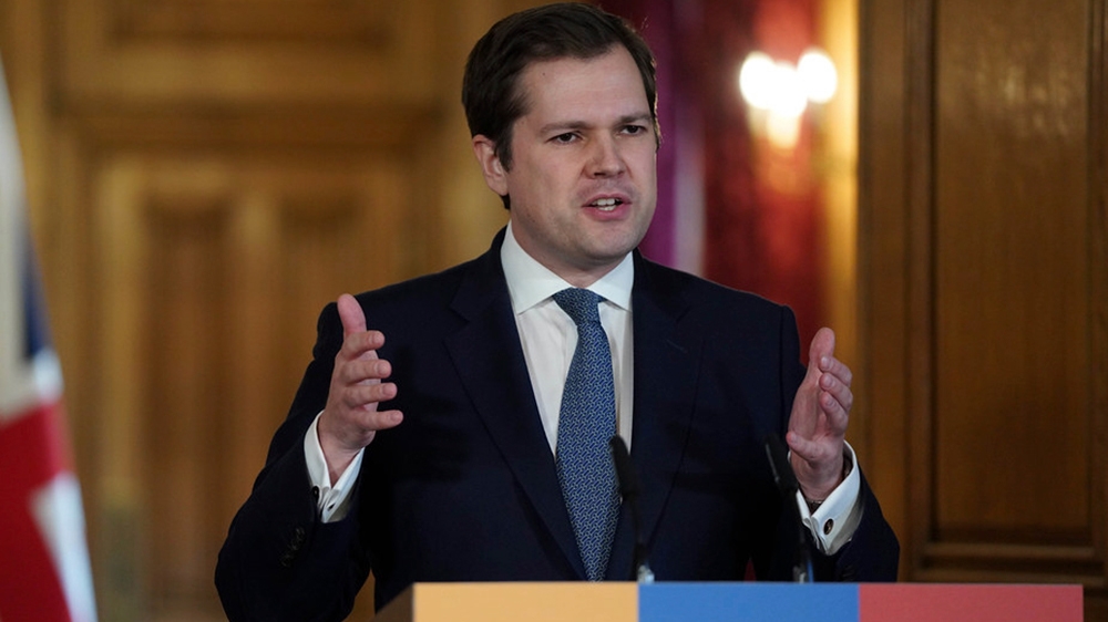 In this handout photo provided by 10 Downing Street, Housing, Communities and Local Government Secretary Robert Jenrick answering questions from the media via a video link during a media briefing on c