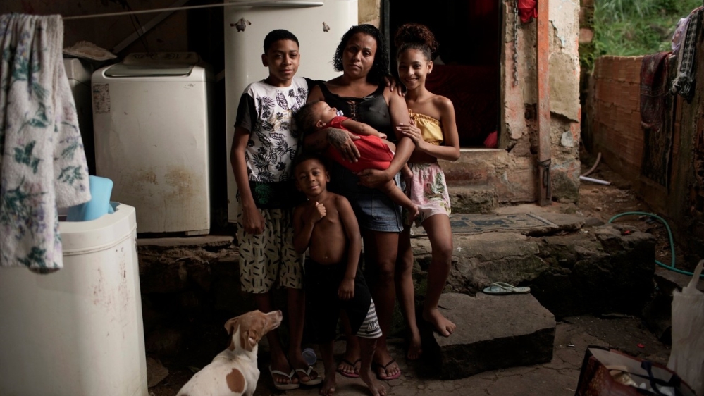 Manicurist Leticia Machado, 31, poses for a photo with 4 of her 7 children at her home in Rio de Janeiro during the coronavirus lockdown