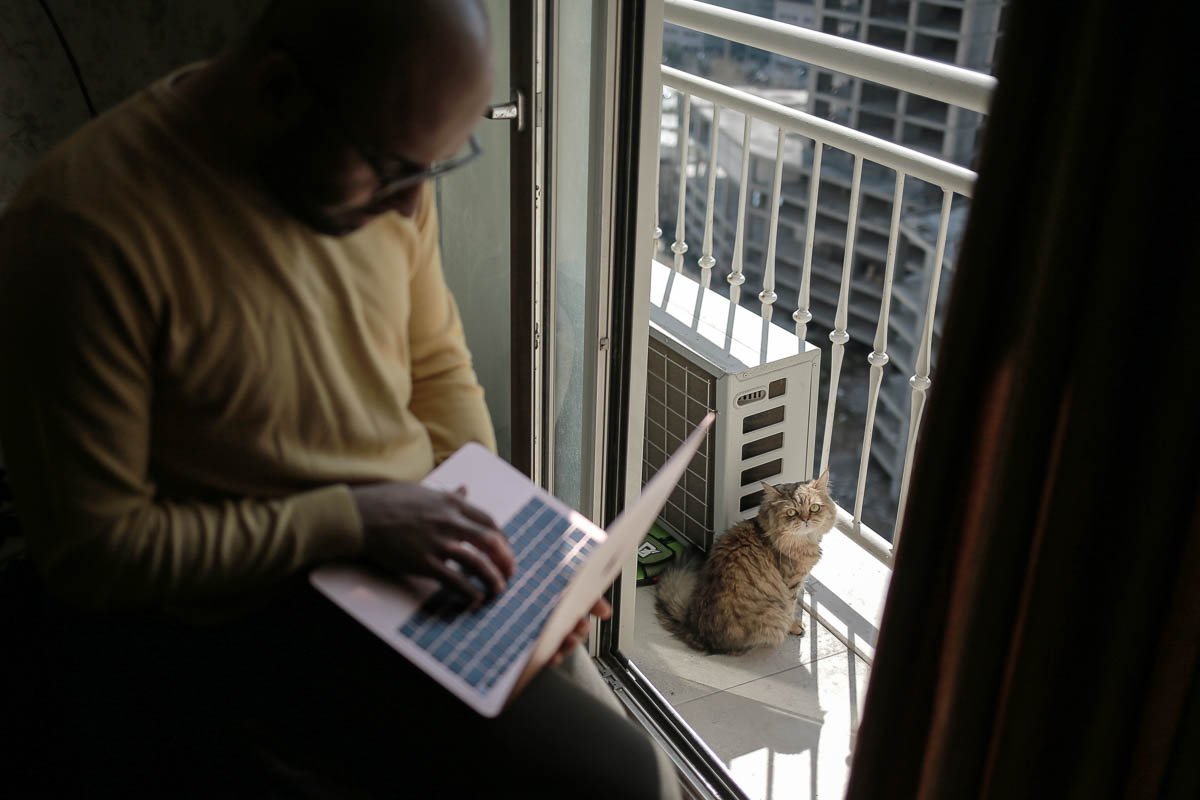 Ahmed and his cat [Hosam Salem/Al Jazeera]