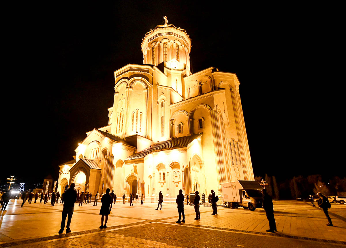 Georgian Orthodox believers, observing social distancing, attend the service on the eve of the Orthodox Easter in Tbilisi on April 18, 2020, as the country tries to curb the spread of the novel corona