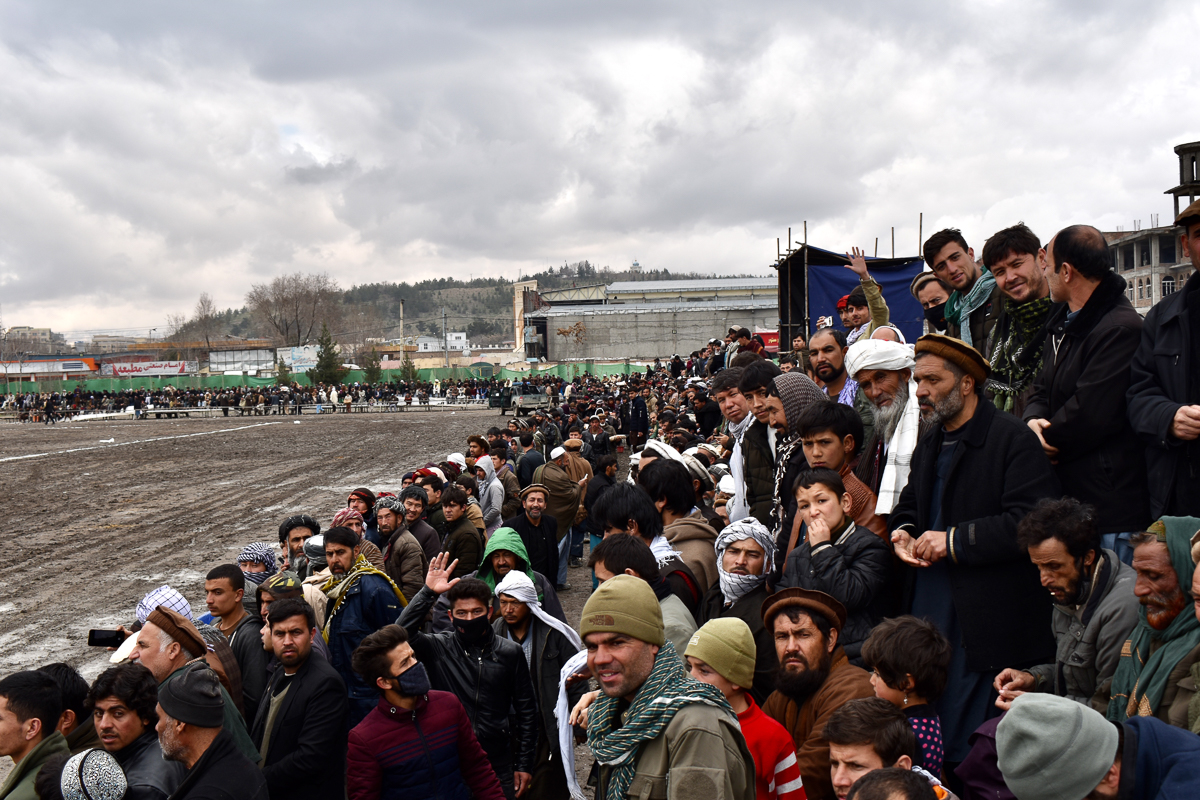 Crowds cheer as a game between Baghlan and Bamyan province takes place on the second day of the Buzkashi league at Chaman-e-Hazouri stadium in Kabul, on Thursday. Photo by Hikmat Noori