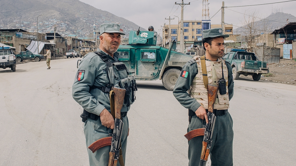 Police close to the scene of the attack against the Sikh temple, 25 March_ [Maciej Stanik/Al Jazeera]
