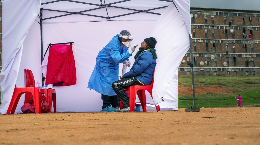 A residents from the Alexandra township gets tested for COVID-19 , in Johannesburg, Wednesday, April 29, 2020. South Africa will begin a phased easing of its strict lockdown measures on May 1, althoug
