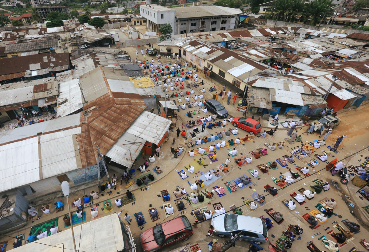 Muslims attend Eid-al-Fitr prayer marking the end of the holy fasting month of Ramadan, amid the spread of the coronavirus disease (COVID-19) in Adjame, a neighbourhood of Abidjan, Ivory Coast May 23,
