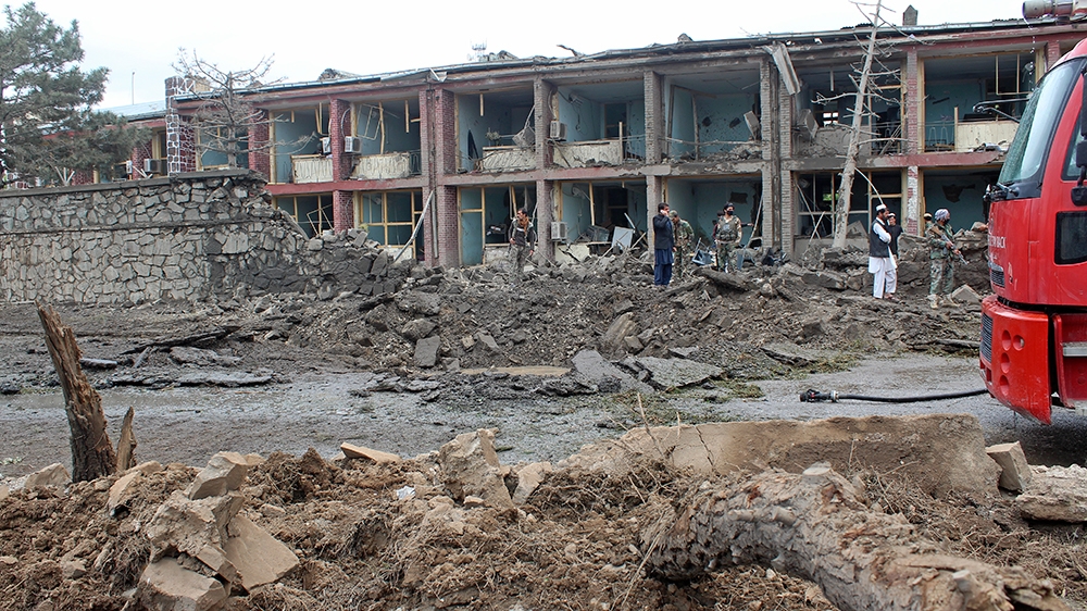 Afghan security personnel inspect the site of an attack on Afghan army base in Gardez, capital of Paktia province on May 14, 2020. - The Taliban said it carried out a deadly attack on May 14 on an Afg