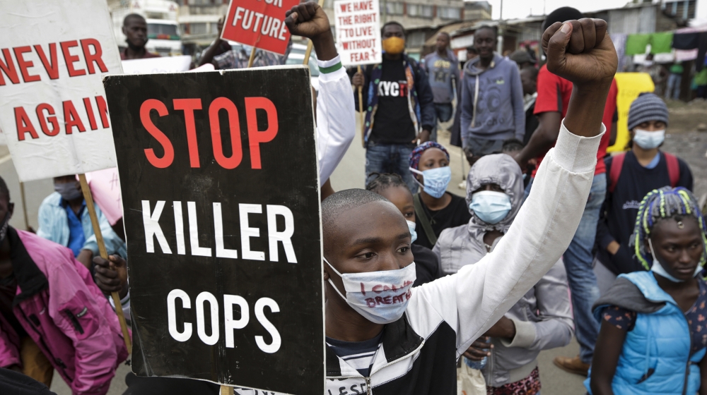 Protesters demonstrate against police brutality, in the Mathare slum, or informal settlement, of Nairobi, Kenya Monday, June 8, 2020. The protest against police brutality in Kenya was in support of th
