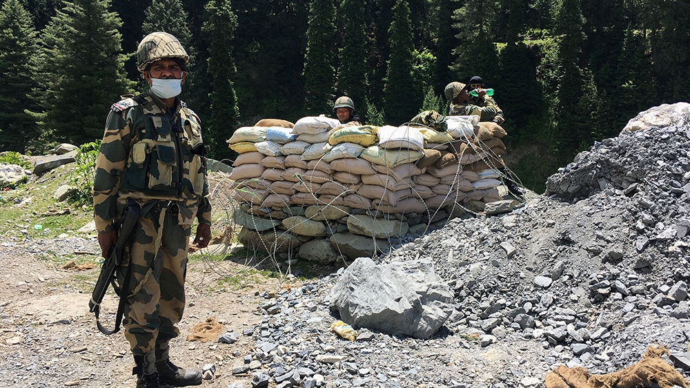 Indian Border Security Force (BSF) soldiers guard a highway leading towards Leh, bordering China, in Gagangir on June 17, 2020. - The long-running border dispute between Asian nuclear powers India and