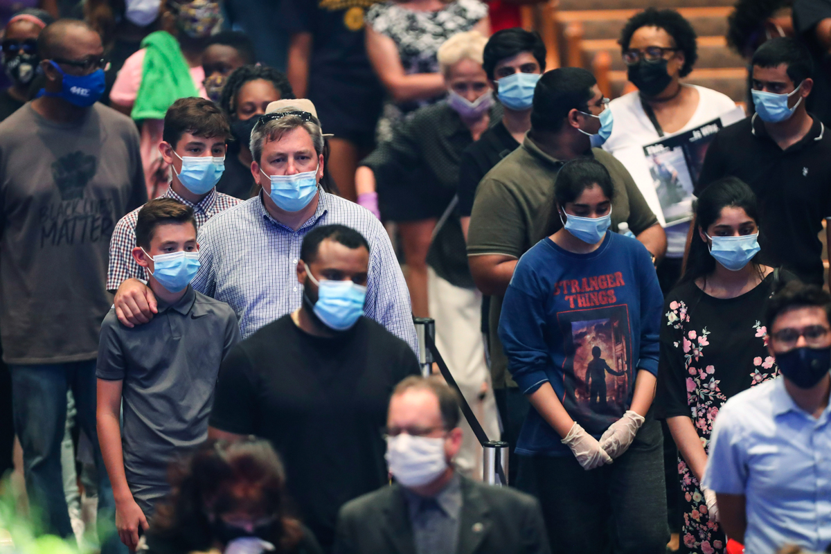 Mourners wait in line to visit the casket of George Floyd during a public visitation Monday, June 8, 2020, at The Fountain of Praise church in Houston. (Godofredo A. Va´squez/Houston Chronicle via AP,