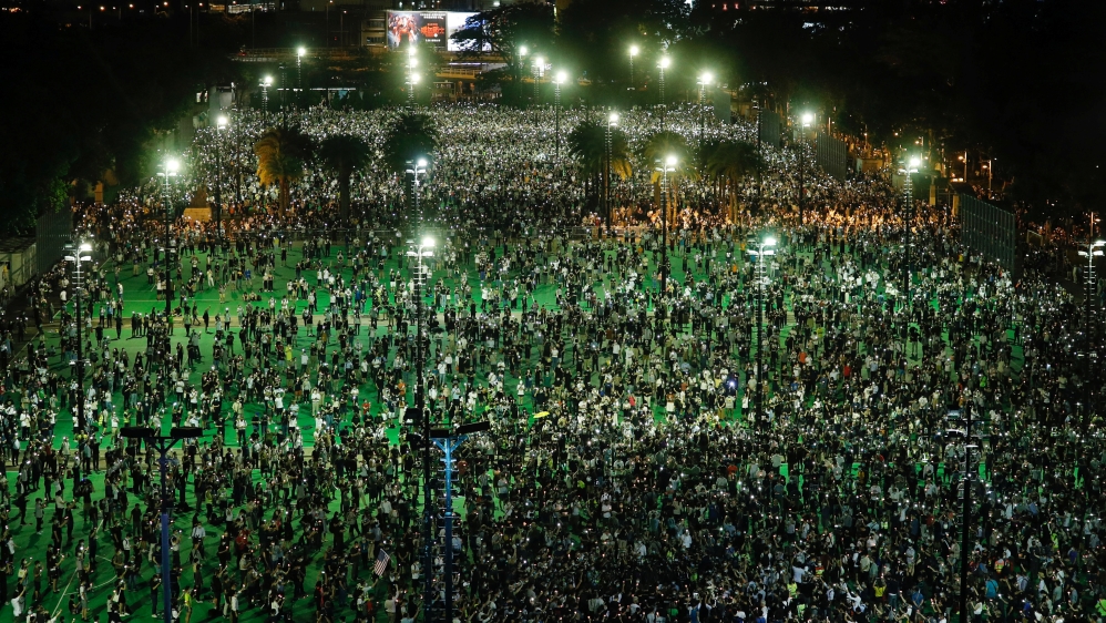 Protesters take part in a candlelight vigil Hong Kong