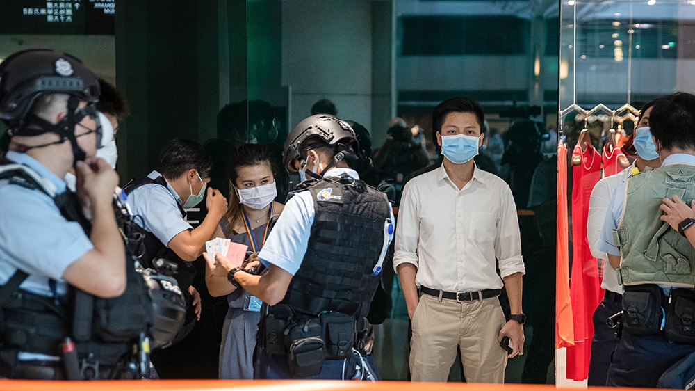 epa08517084 Police detain pro-democracy protesters during a ''lunch with you'' rally at a shopping mall in Hong Kong, China, 30 June 2020. China''s National People''s Congress Standing Committee has unani