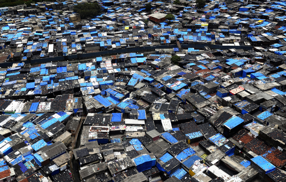 A general view of a slum area, some of which are containment zones, in Mumbai, India, Sunday, June 28, 2020. India is the fourth hardest-hit country by the COVID-19 pandemic in the world after the U.S