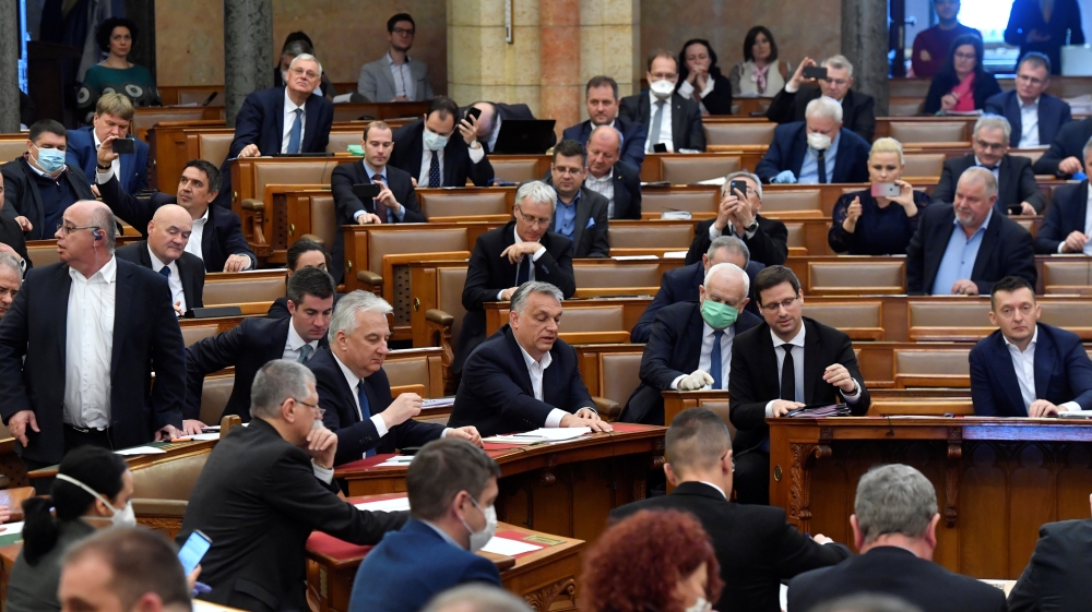 Hungarian Prime Minister Orban votes the law granting the government special powers to combat the coronavirus disease (COVID-19) crisis at the Hungarian parliament in Budapest