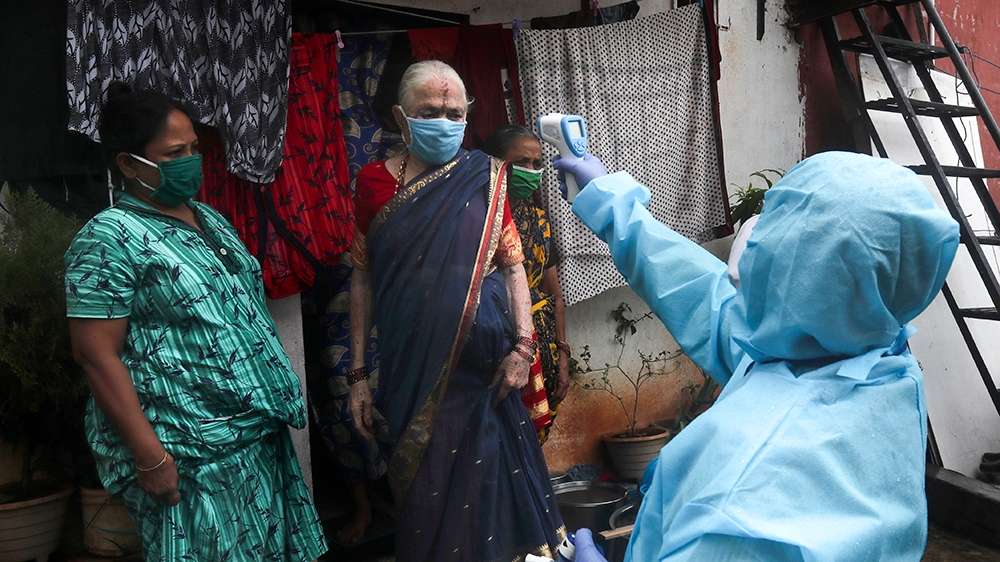In Mumbai, it is estimated that 40 percent of the population lives in slums [AP]