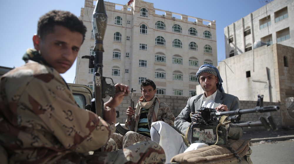 Shiite fighters, known as Houthis, pose for a photo as they secure a road, as people take part in a march from Sanaa to the port city of Hodeidah, Yemen. From Lebanon and Syria to Iraq, Yemen, and the