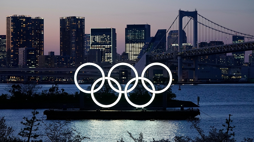 epa08389035 (FILE) - A giant Olympic rings monument is illuminated at dusk at Odaiba Marine Park in Tokyo, Japan, 25 March 2020 (issued 28 April 2020). According to local media reports, during an inte