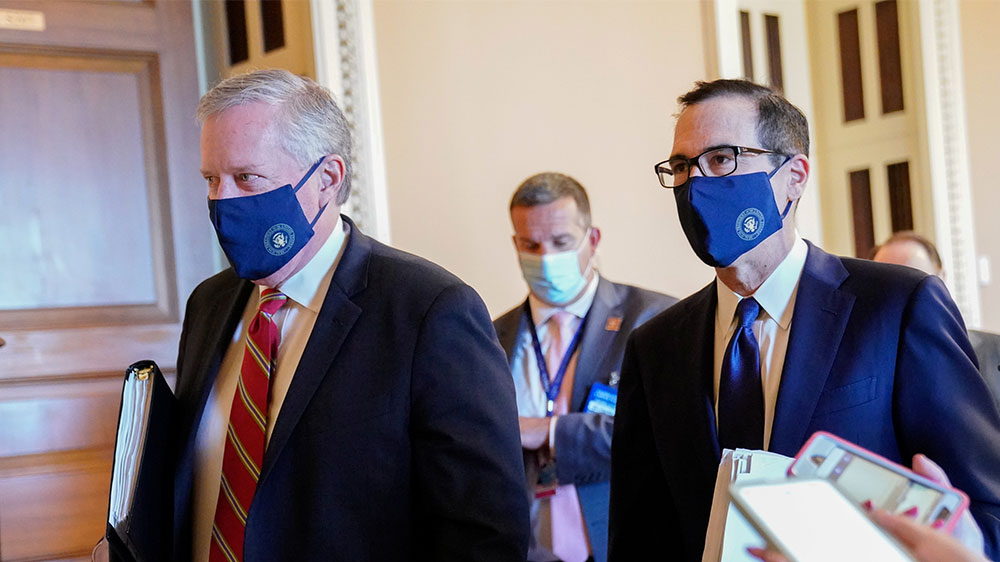 White House Chief of Staff Mark Meadows and Treasury Secretary Steve Mnuchin walk together in the US Capitol in Washington, DC as talks on coronavirus spending with Democratic leaders reached a deadlock on July 29, 2020